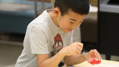 A boy experimenting